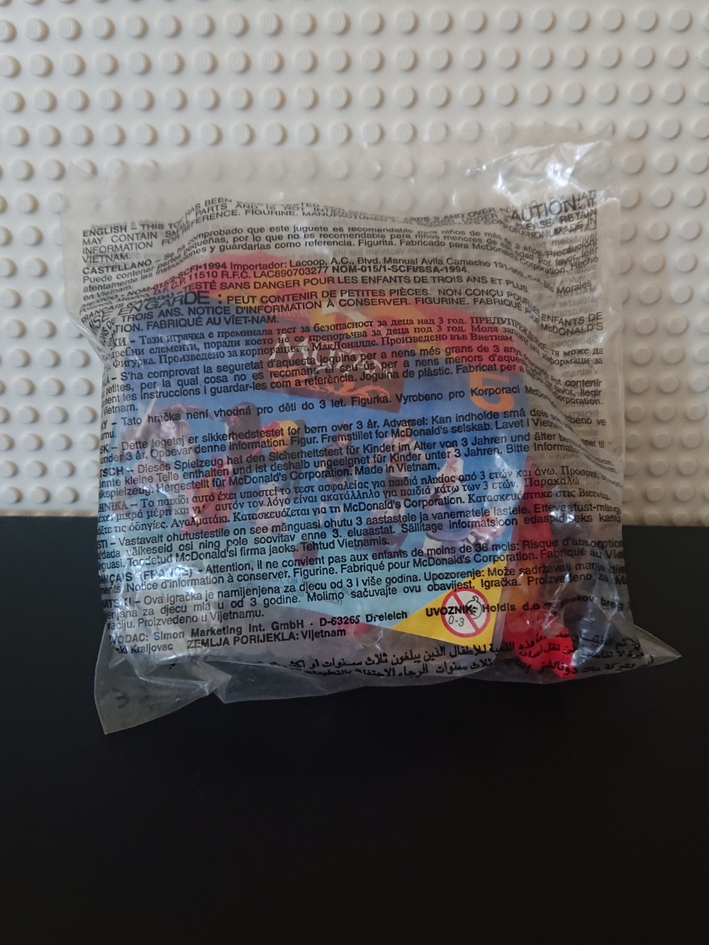 McDonald's Clear Packaged Toy with Red and Black Details